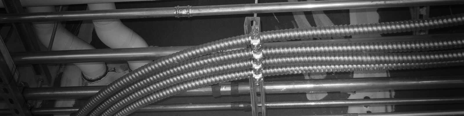 Is there a “standard” for what rigid conduit is used for vs Metal Clad cable  in situations like this? Like rigid conduit is coming from panel and MC is  going to outlets