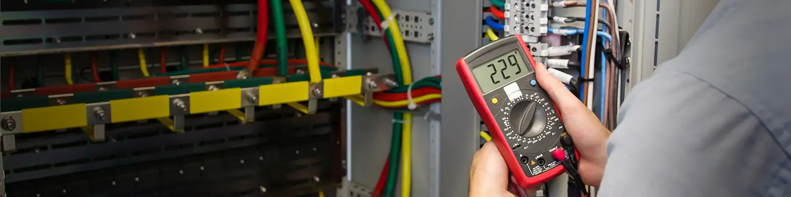 Electrician Testing Cable with Multimeter